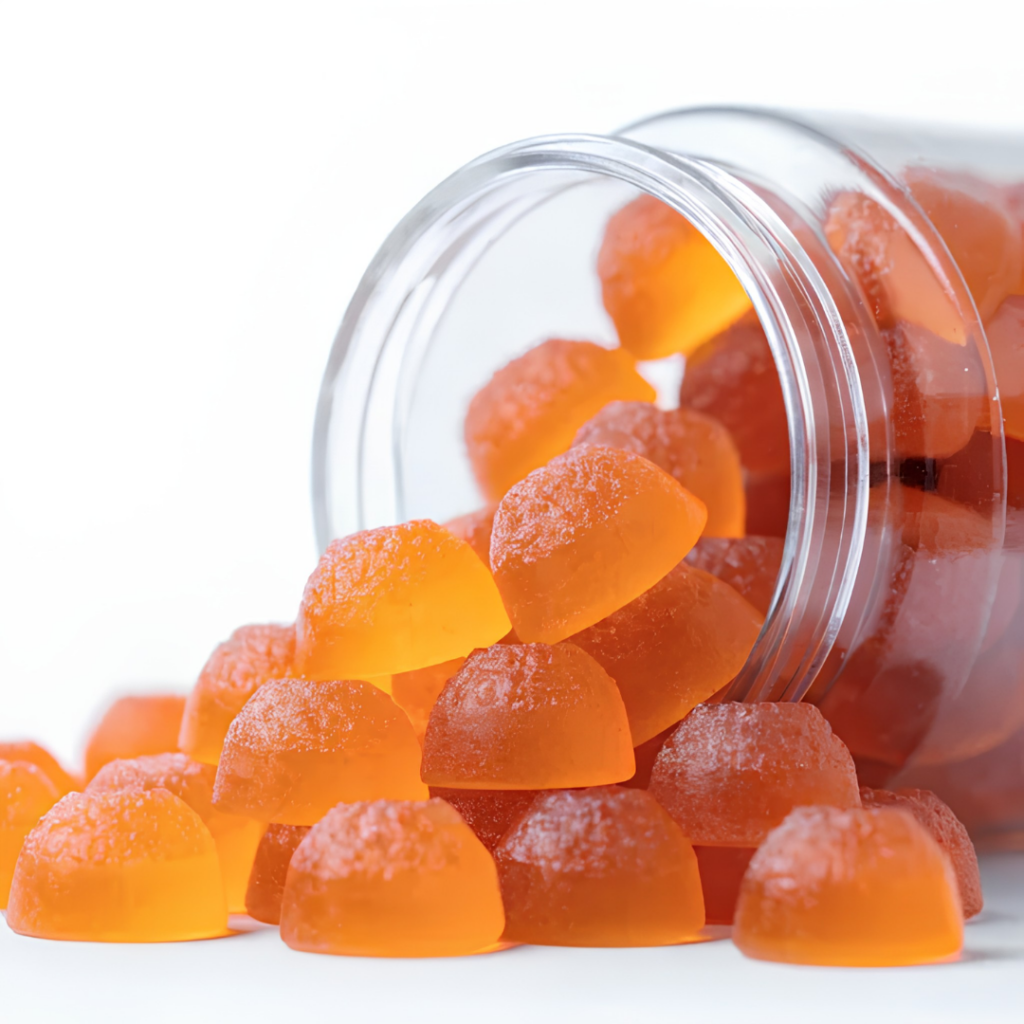 Orange superfood gummies in a supplement bottle for private label gummy manufacturing