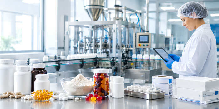 Supplement manufacturing facility with capsules, powders, gummies, and bottles during production